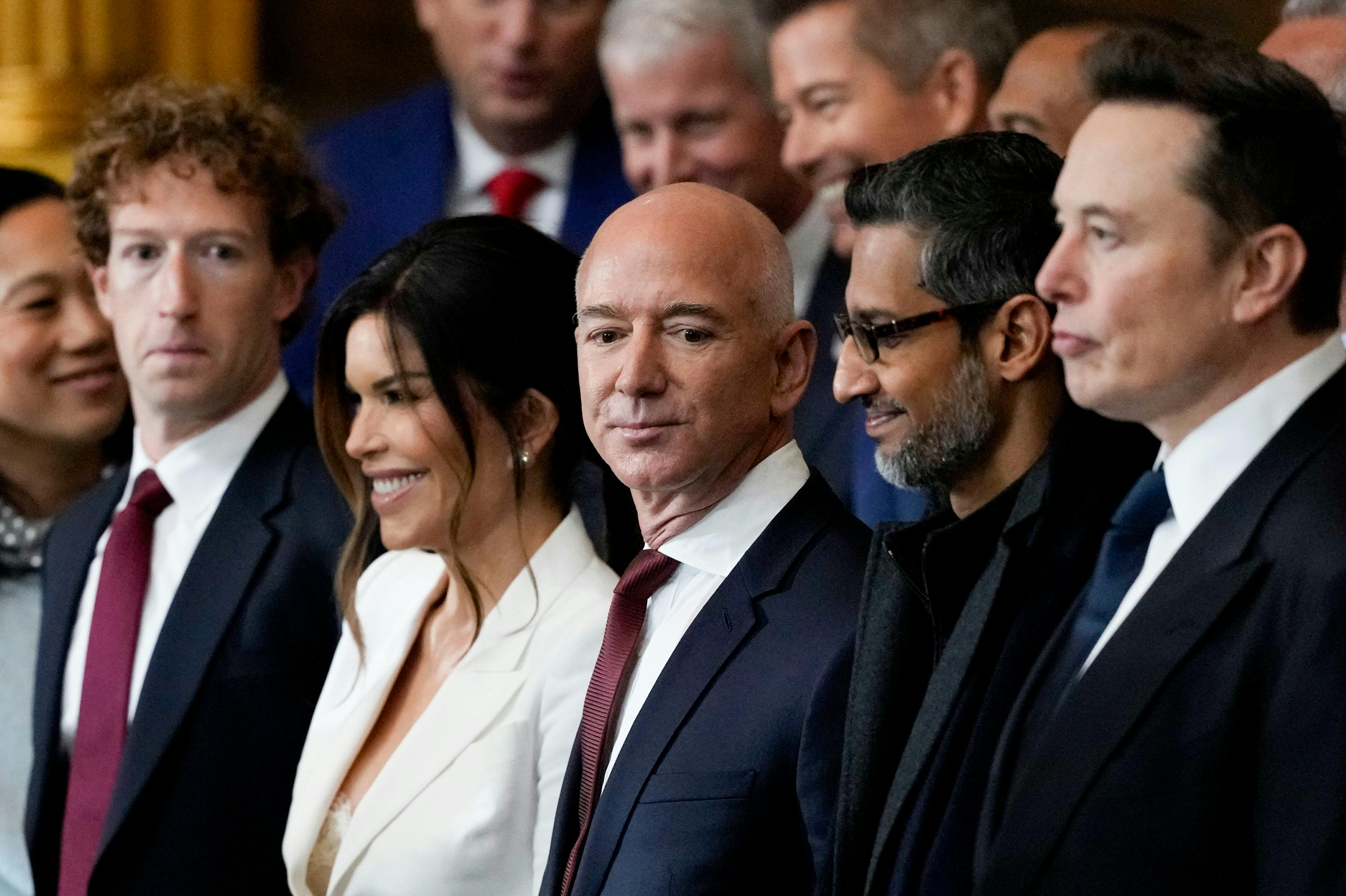 Meta CEO Mark Zuckerberg, Lauren Sanchez, Amazon founder Jeff Bezos, Alphabet CEO Sundar Pichai, and Tesla CEO Elon Musk all stand side by side at Donald Trump’s inauguration.