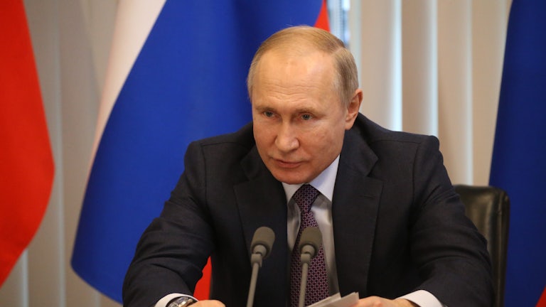 A close up of Russian president Vladimir Putin at a conference in Yalta.