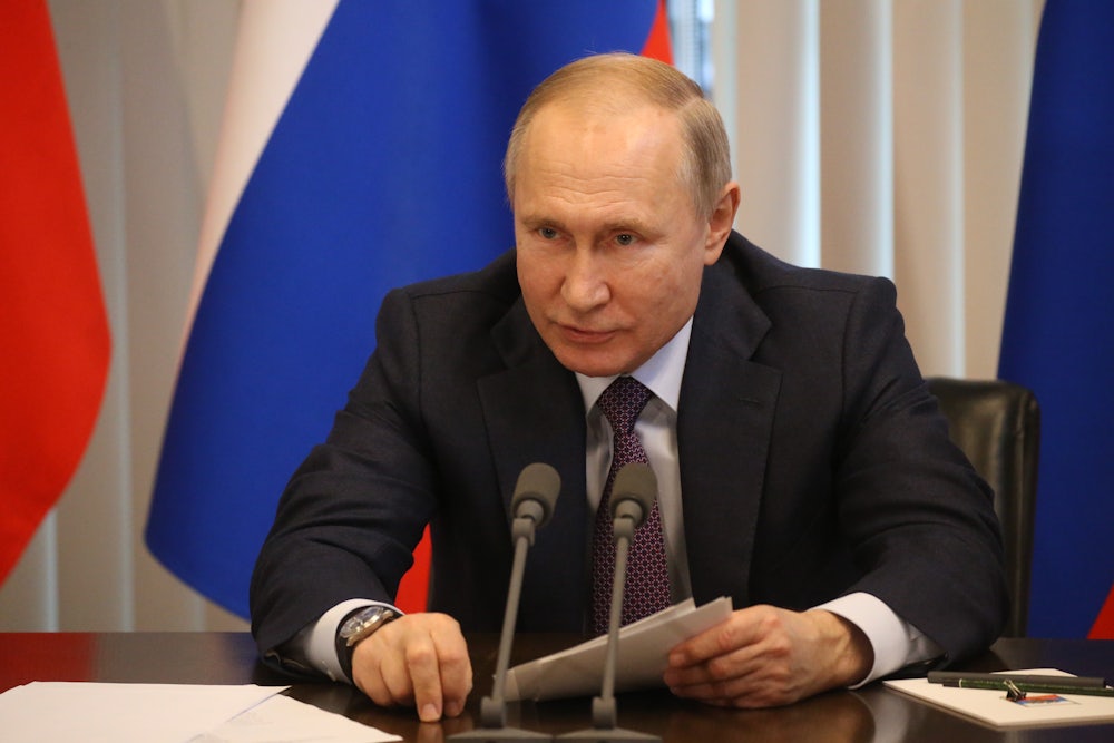 A close up of Russian president Vladimir Putin at a conference in Yalta.