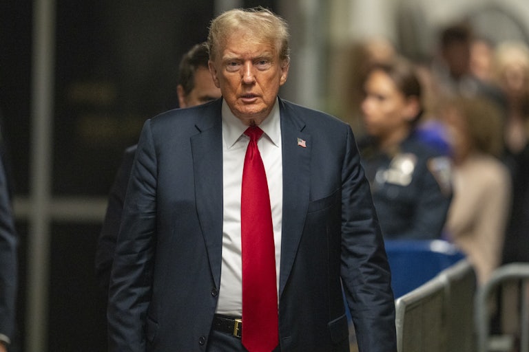 Donald Trump walks in the courtroom