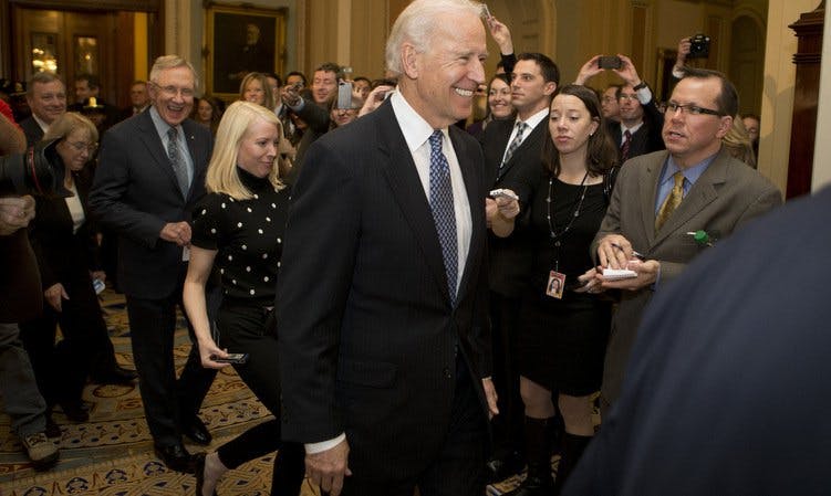 Vice President Joe Biden arrives at a Democratic caucus meeting, merriment in tow. (Andrew Harrer/Bloomberg/Getty Images)