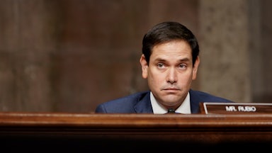 Republican Senator Marco Rubio sits behind his name plate.