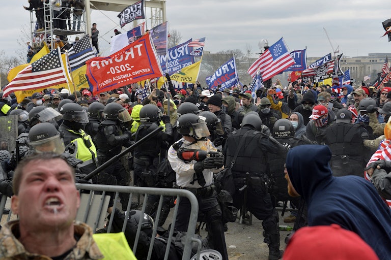 Trump supporters clash with police and security forces as people try to storm the U.S. Capitol Building on January 6, 2021.