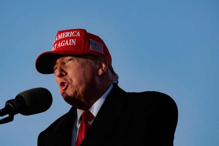Donald Trump speaks into a microphone