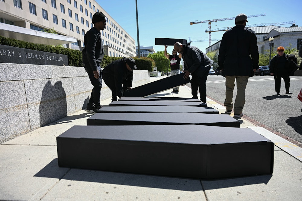 HIV advocates carrying mock coffins protest in front of the U.S. State Department, demanding the full restoration of United States President’s Emergency Plan for AIDS Relief, or PEPFAR, in Washington, D.C.