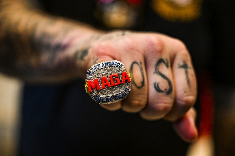 A supporter of former US President and 2024 presidential hopeful Donald Trump wears a MAGA ring as he attends a Super Tuesday election night watch party at Mar-a-Lago.