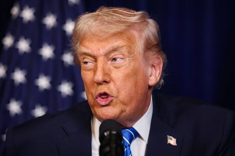 Donald Trump speaks into a microphone during a joint press conference with Ukrainian President Volodymyr Zelenskiy