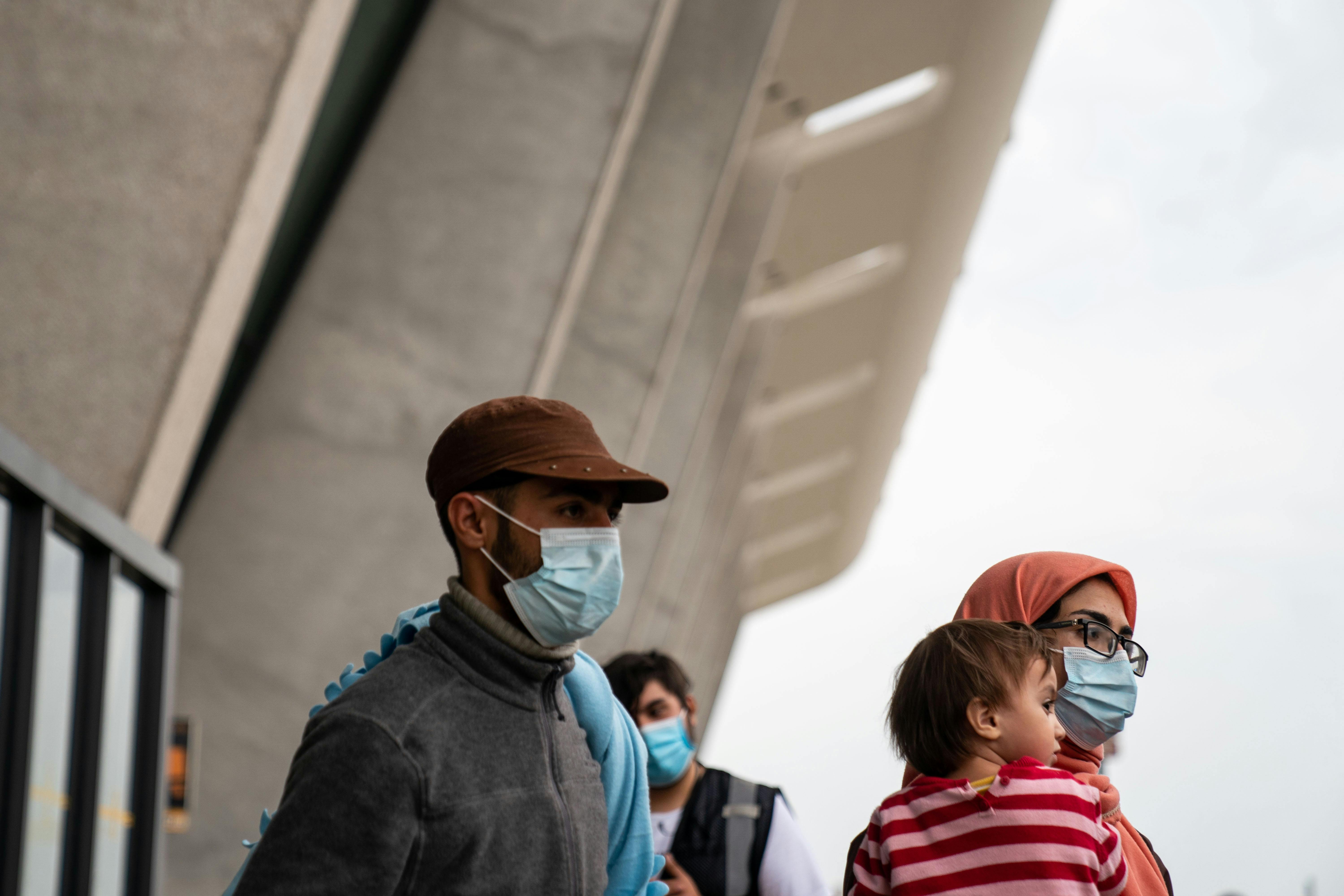 Evacuees fleeing Afghanistan arrive at Dulles International Airport in Northern Virginia.