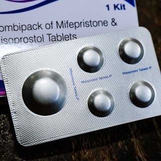Box that reads "Combipack of Mifepristone and Misoprostol Tablets" and some pills in front of it