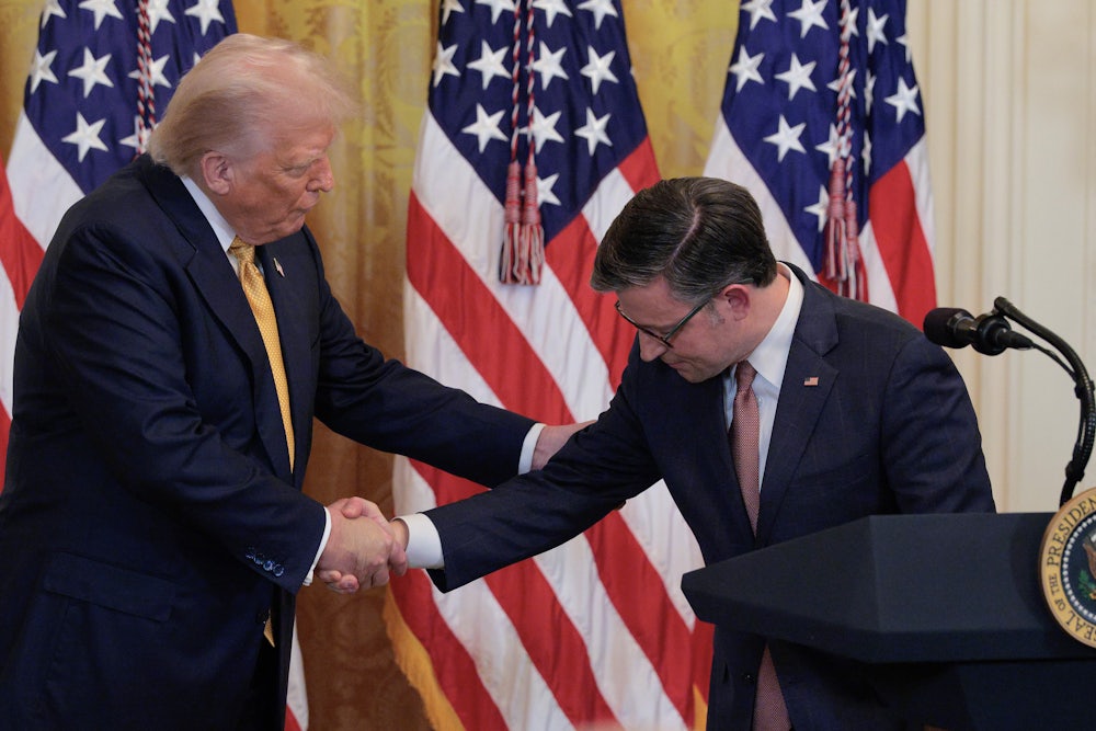 President Donald Trump and House Speaker Mike Johnson shake hands.