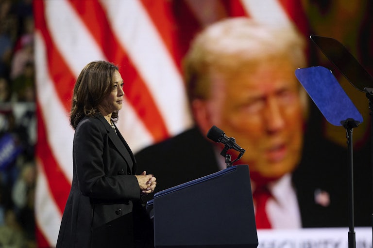 Kamala Harris shows video of Donald Trump at a campaign event in Erie, Pennsylvania.