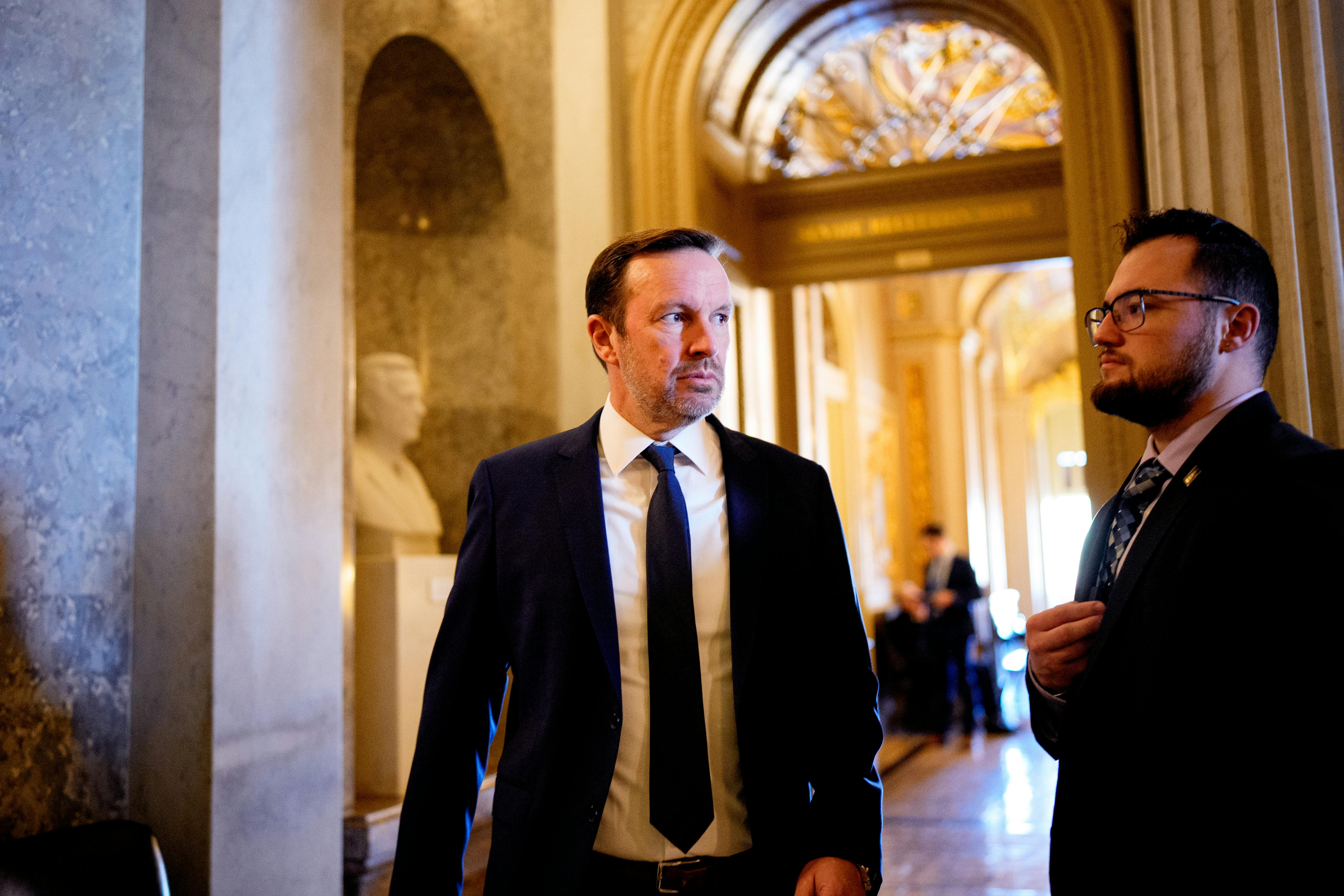 Democratic Senator Chris Murphy walks to a meeting.