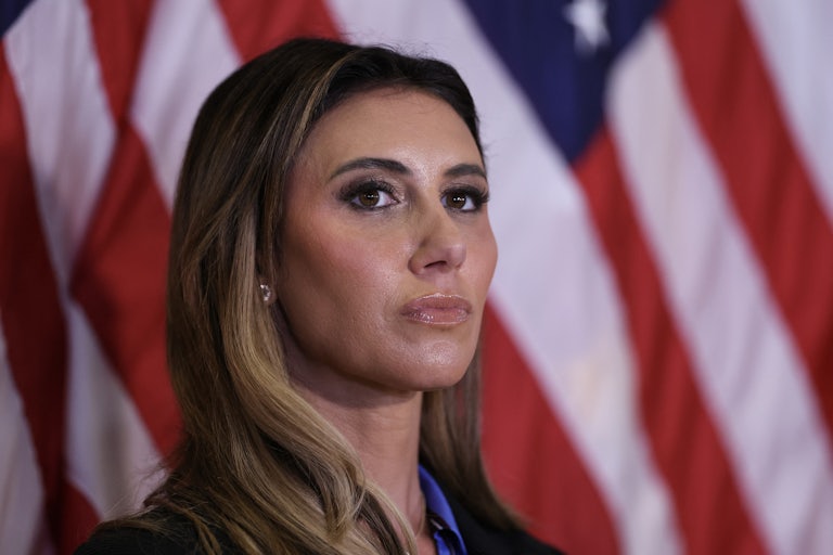 Alina Habba looks at the crowd during a Donald Trump speech