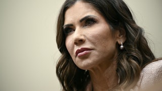 Homeland Security Secretary Kristi Noem stands during a House committee hearing