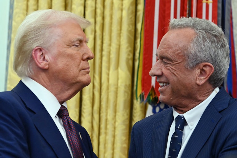 Donald Trump and Robert F. Kennedy Jr. shake hands in the Oval Office