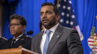 FBI Director Kash Patel speaks at a podium