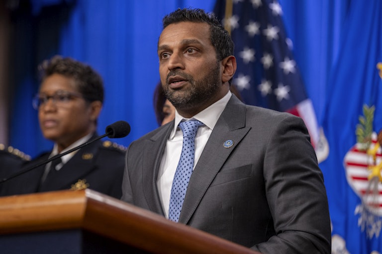 FBI Director Kash Patel speaks at a podium