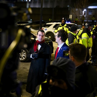 Paul Ingrassia puts his hand on his chest while speaking to reporters