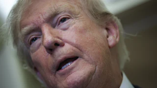Donald Trump speaks to reporters on Air Force One