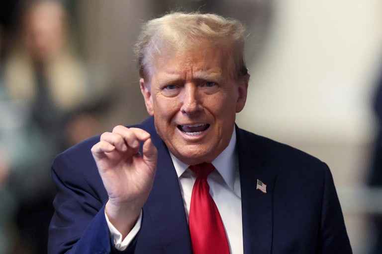 Donald Trump gestures while he speaks