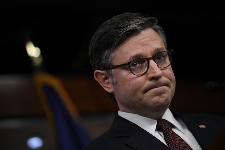 Mike Johnson frowns during a press conference