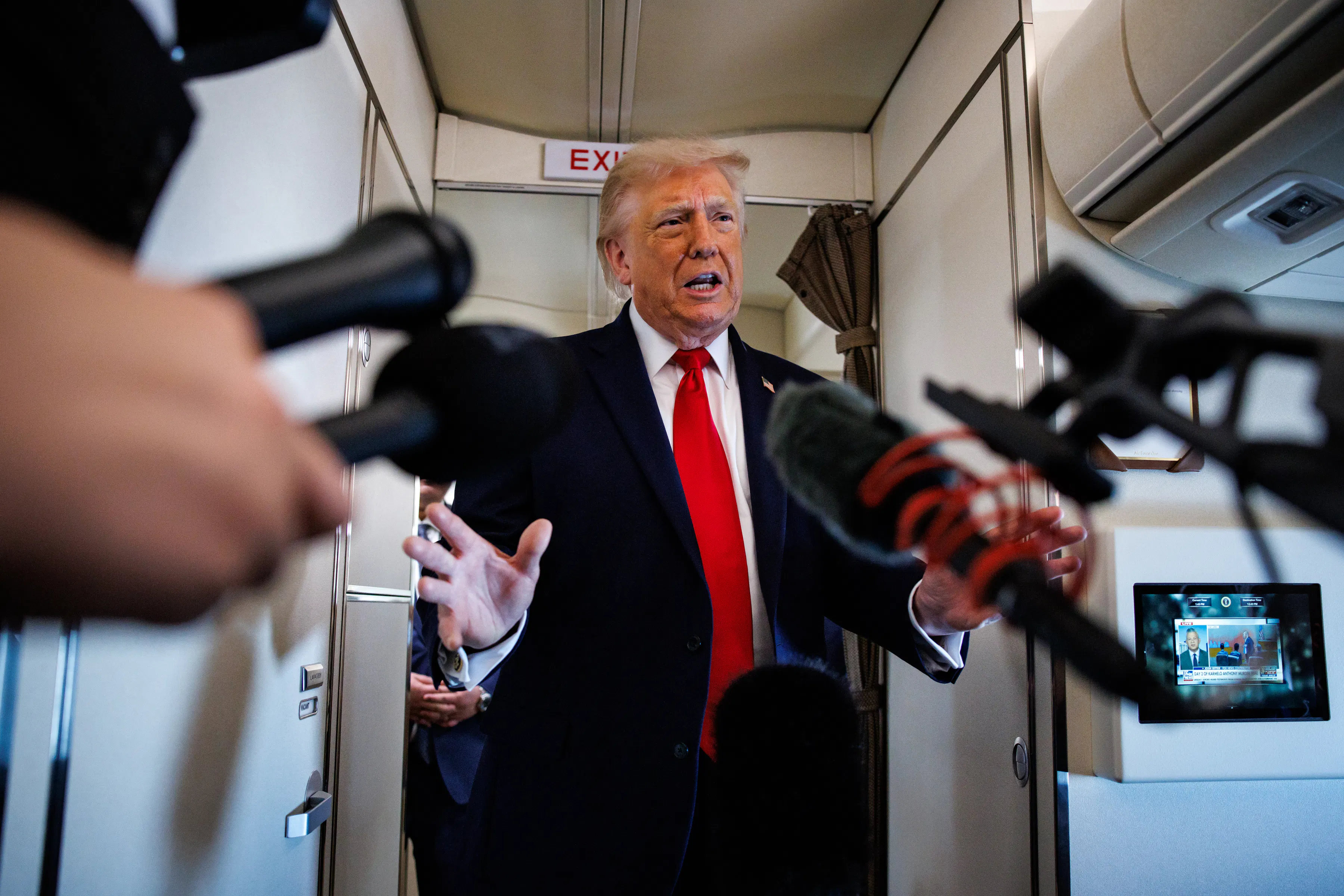 Trump speaking to reporters aboard Air Force One