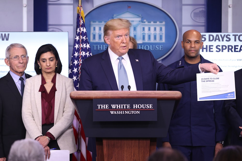 Donald Trump flanked by members of the Coronavirus Task Force, speaks to the media in the press briefing room at the White House on March 16, 2020 in Washington, DC.