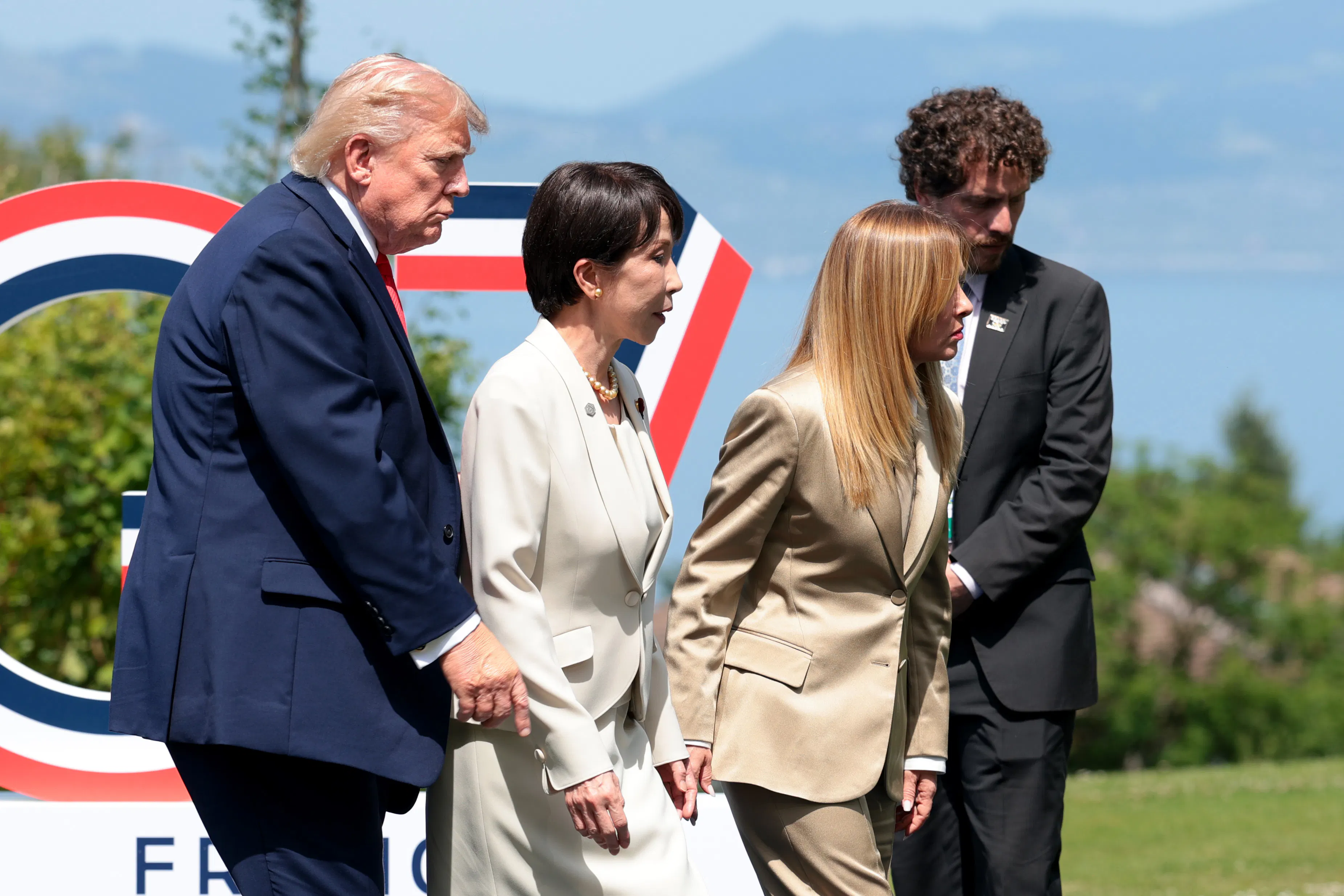 U.S. President Donald Trump, Prime Minister of Japan Sanae Takaichi and Prime Minister of Italy Giorgia Meloni leave following a photo at the G7 summit in France.