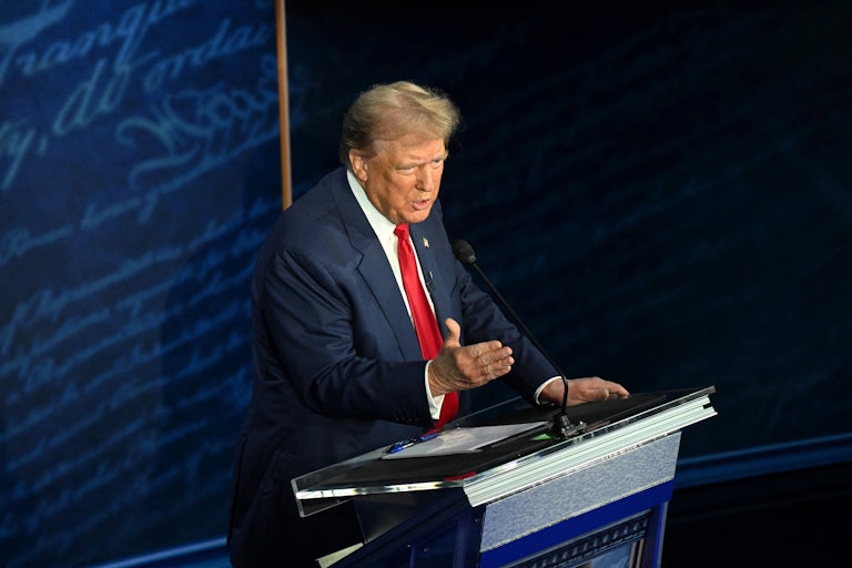 Donald Trump speaks at a podium during the presidential debate