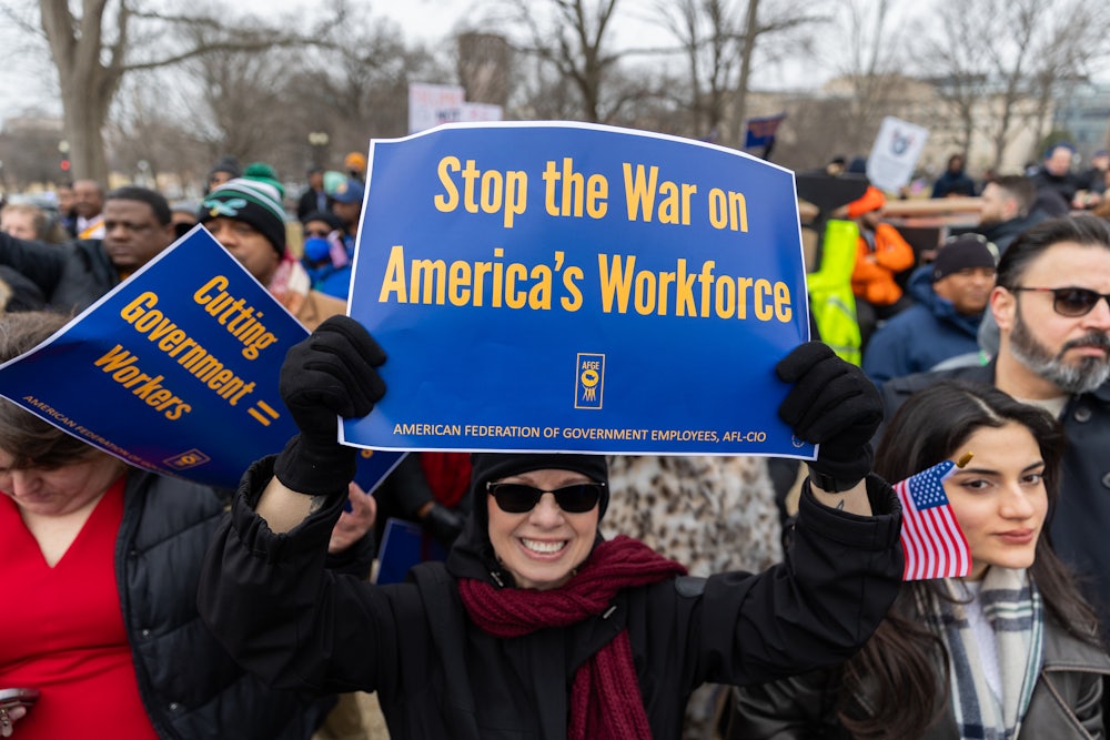 Members of the American Federation of Government Employees (AFGE) union protest against firings during a rally to defend federal workers in Washington, DC on February 11, 2025.