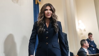 Homeland Security Secretary Kristi Noem walks into a House committee hearing