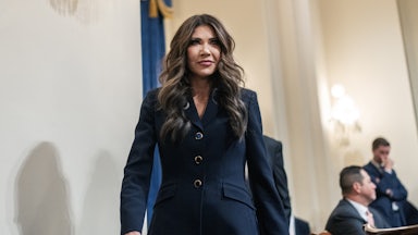 Homeland Security Secretary Kristi Noem walks into a House committee hearing