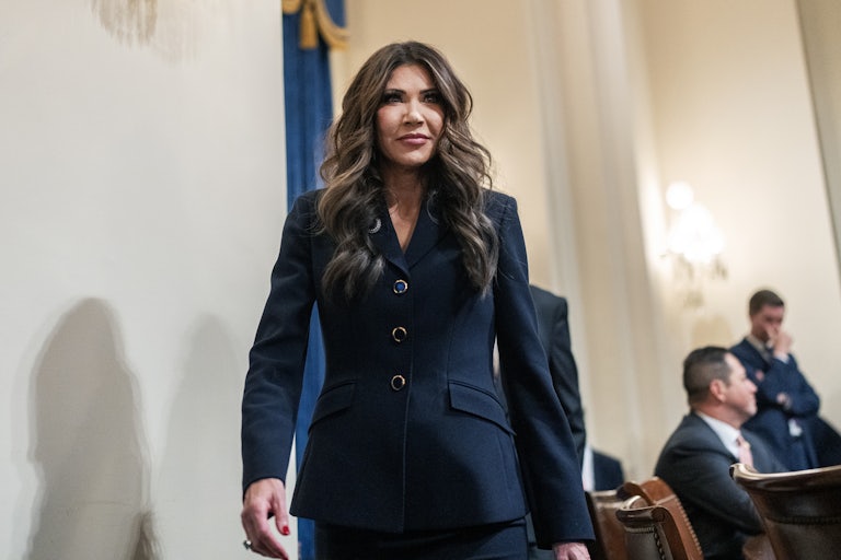 Homeland Security Secretary Kristi Noem walks into a House committee hearing