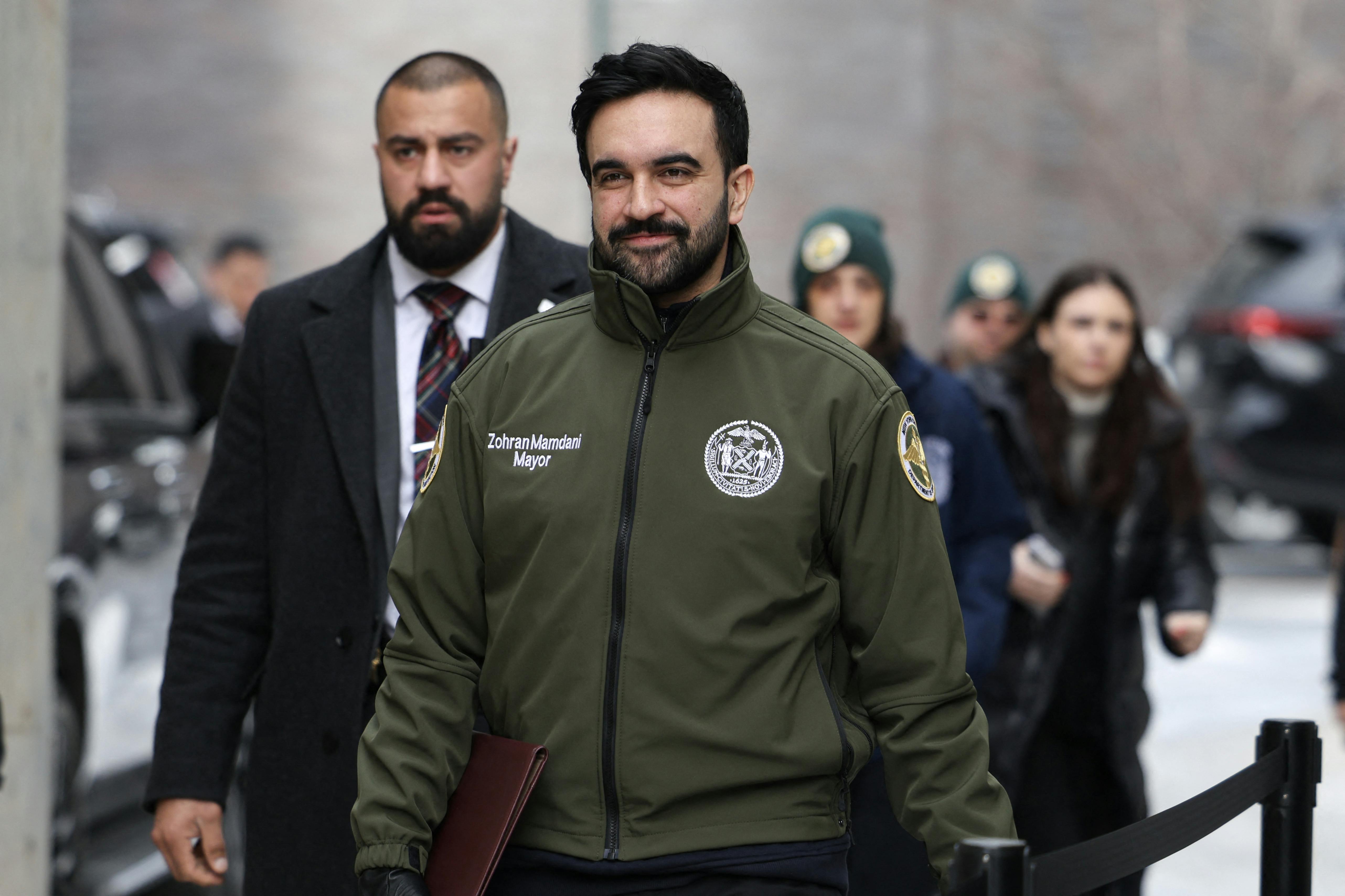 Mamdani walking to a press conference 