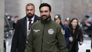 Mamdani walking to a press conference