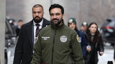 Mamdani walking to a press conference