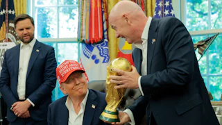 FIFA boss Gianni Infantino shows Donald Trump the World Cup trophy