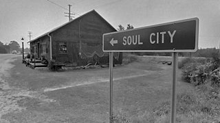 A highway sign for Soul City on Route 1.