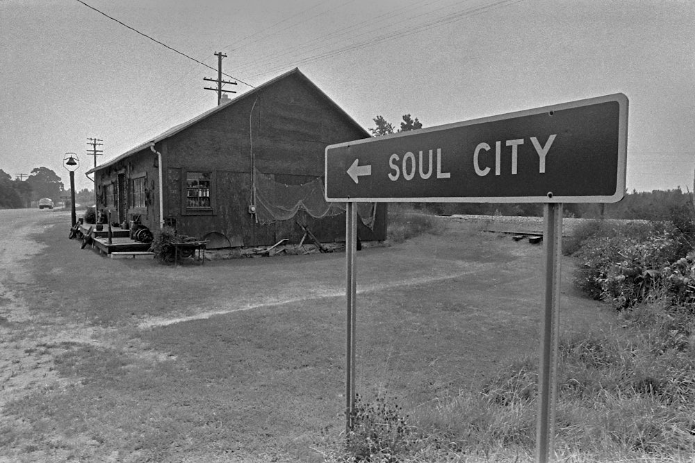 A highway sign for Soul City on Route 1.