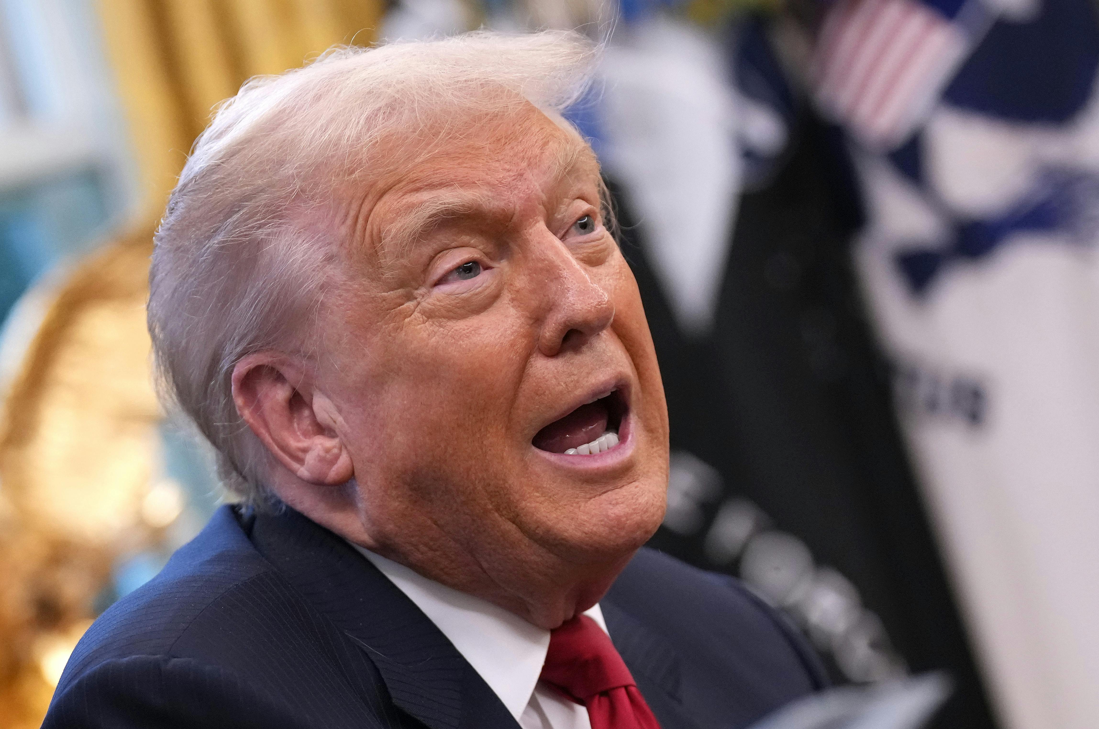 Donald Trump tilts head back and speaks vehemently