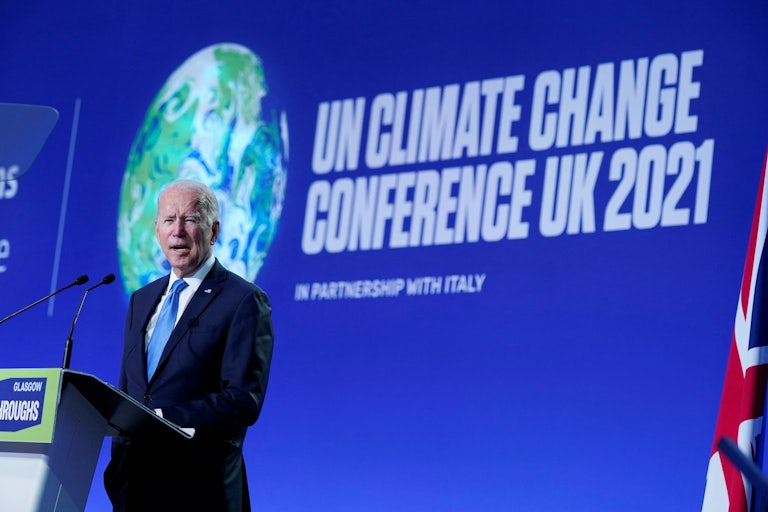 President Joe Biden delivers a speech on stage during a meeting at the COP26 UN Climate Change Conference in Glasgow, Scotland.