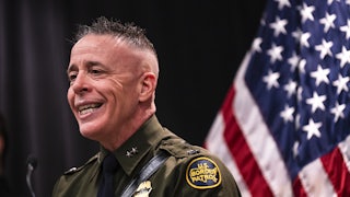 Customs and Border Protection Commander Gregory Bovino smiles while speaking during a press conference in Minneapolis, Minnesota