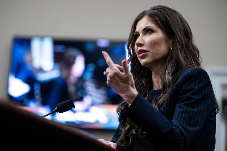 Homeland Security Secretary Kristi Noem gestures while testifying in a House hearing
