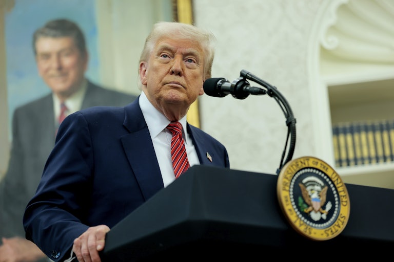 Donald Trump stands at the presidential podium in the White House.