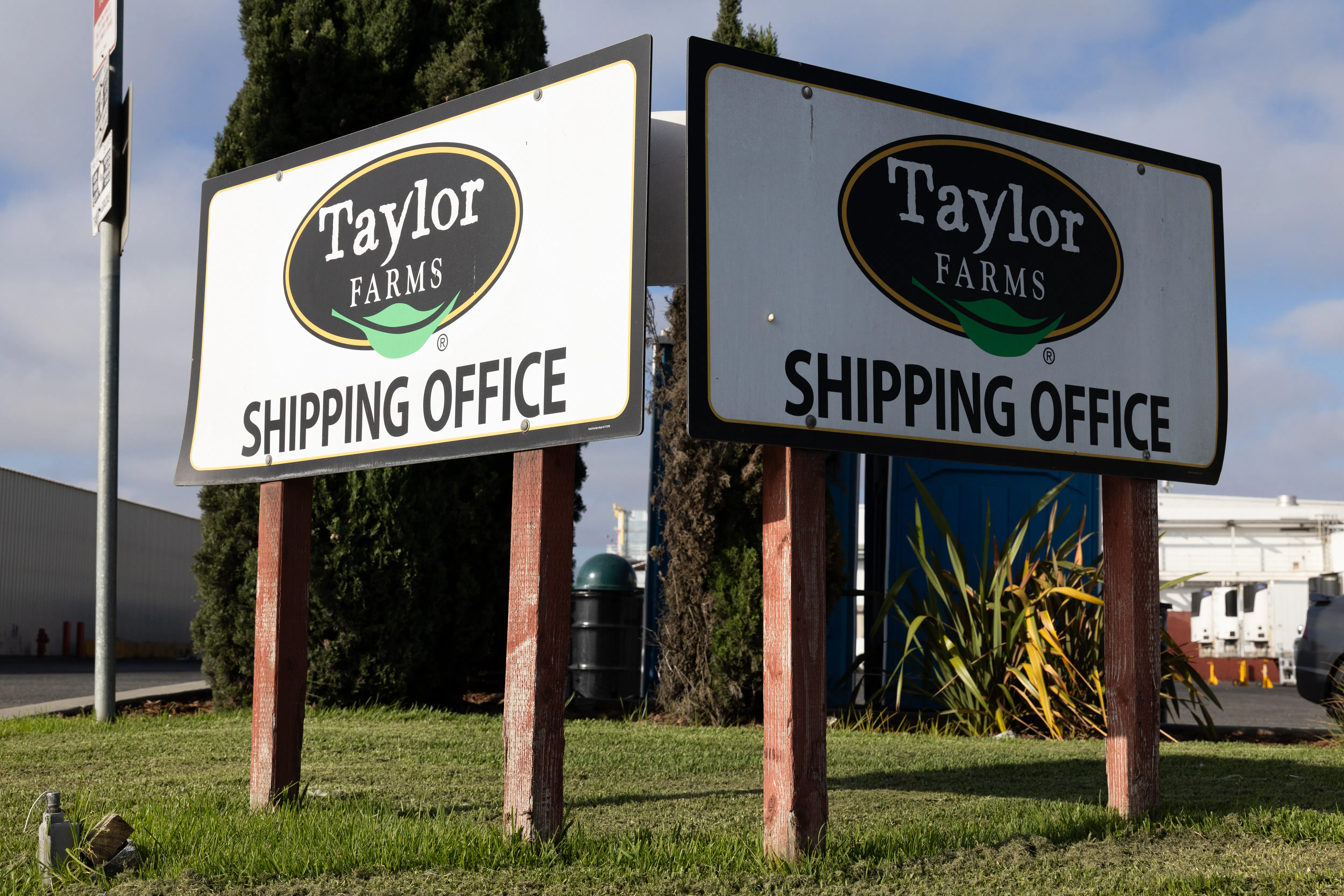 Signs that say "Taylor Farms shipping office" at a Taylor Farms facility