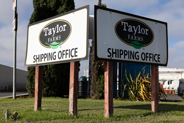 Signs that say "Taylor Farms shipping office" at a Taylor Farms facility