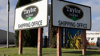 Signs that say "Taylor Farms shipping office" at a Taylor Farms facility