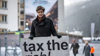 Austrian Marlene Engelhorn with "tax the rich" sign