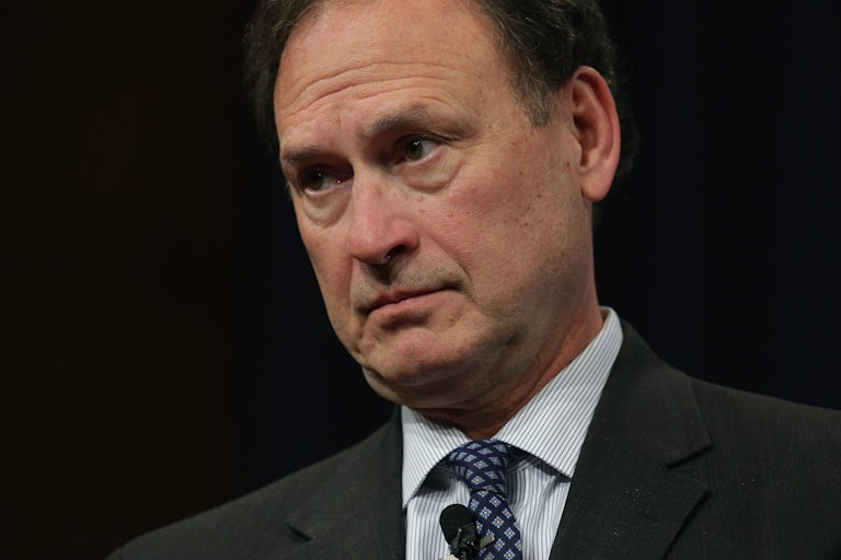 Supreme Court Justice Samuel Alito looks down