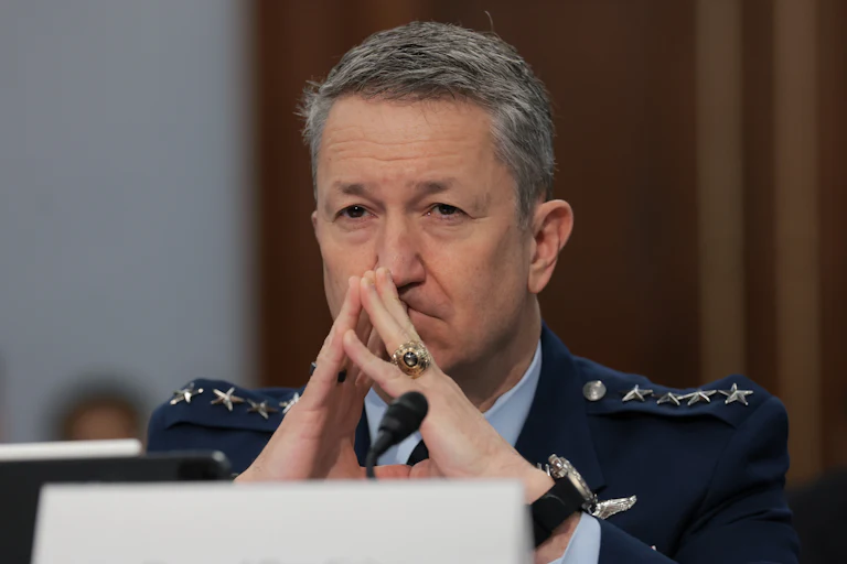 Chairman of the Joint Chiefs of Staff General Dan Caine testifies in Congress and steeples his fingers